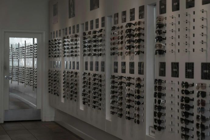 Wall display of sunglasses in an optical shop.